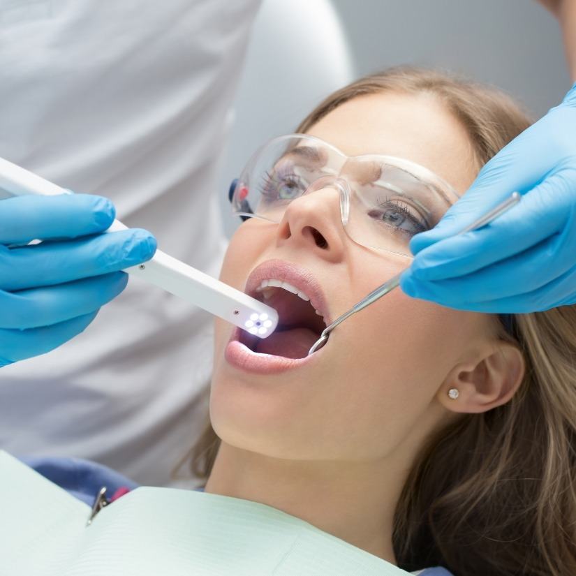 Dentist using intraoral camera to capture smile photos