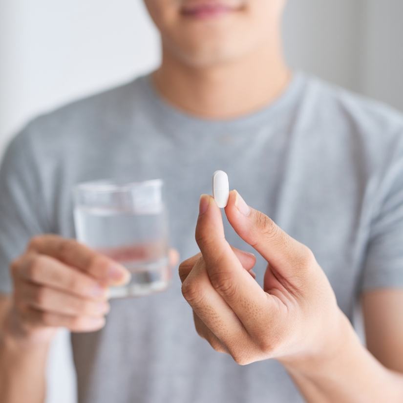Person holding an oral conscious dental sedation pill